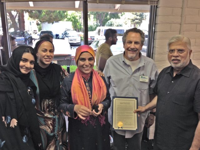 On behalf of the city of Mountain View, Lenny is presenting a proclamation recognizing the month of August, 2018 as Muslim American Appreciation and Awareness Month.